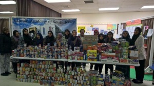 Volunteers who came together to sort and count over 3,000 cans collected for our "Feed Their Legacy" food drive in memory of the 2015 Chapel Hill Shooting victims. 